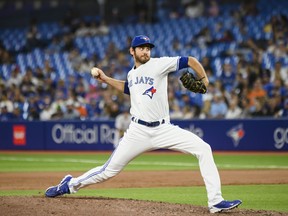 Toronto Blue Jays pitcher Jordan Romano throws the ball during a game.