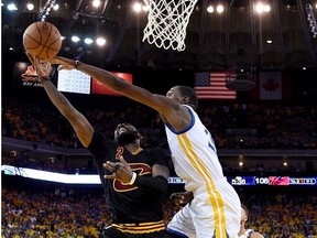 Kyrie Irving of the Cleveland Cavaliers goes up for a shot against Kevin Durant of the Golden State Warriors in Game 5 of the 2017 NBA Finals at ORACLE Arena on June 12, 2017 in Oakland, California.