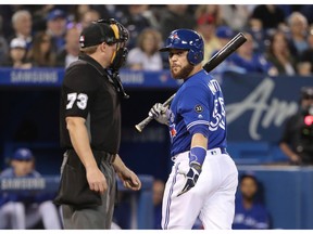 Russell Martin of the Toronto Blue Jays argues a called third strike call by home plate umpire Tripp Gibson in the second inning during MLB game action against the Oakland Athletics at Rogers Center on May 18, 2018 in Toronto, Canada.