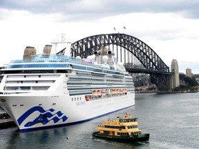 The Coral Princess cruise ship is seen docked at the International Terminal on Circular Quay in Sydney on July 13, 2022. The Coral Princess docked in Sydney with more than 100 COVID-19 positive crew members and passengers onboard, reports said.