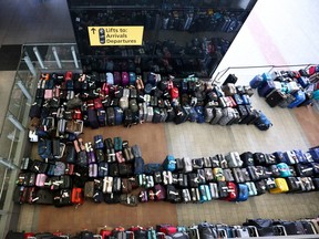 Lines of passenger luggage lie arranged outside Terminal 2 at Heathrow Airport in London June 19, 2022.