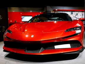 A Ferrari SF90 Stradale hybrid sports car is seen during a media preview at the Auto Zurich Car Show in Zurich, Switzerland November 3, 2021.