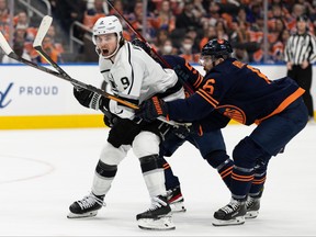 Edmonton Oilers’ Kris Russell, right, battles L.A. Kings’ Adrian Kempe during second period of NHL playoff action at Rogers Place in Edmonton, on Monday, May 2, 2022.