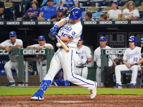 Kansas City Royals left fielder Andrew Benintendi (16) hits a one run double against the Detroit Tigers in the eighth inning at Kauffman Stadium July 12, 2022.