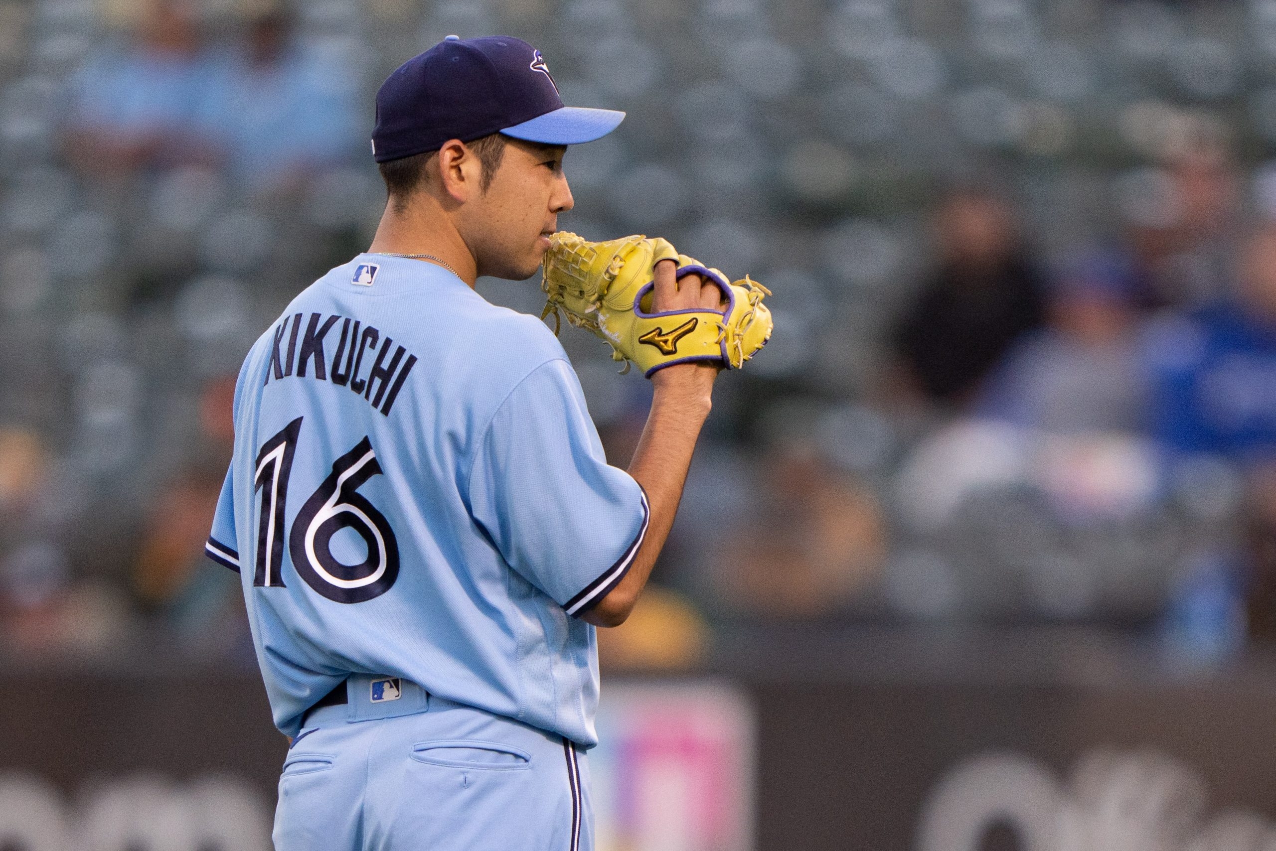 Yusei Kikuchi of the Toronto Blue Jays smiles at the end of the