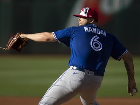 Blue Jays starting pitcher Alek Manoah (6) delivers a pitch against the Oakland Athletics in the first inning at RingCentral Coliseum on Monday night.