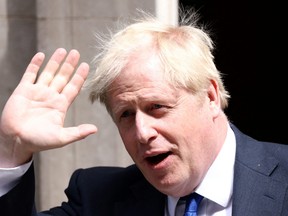 British Prime Minister Boris Johnson walks at Downing Street in London, July 6, 2022.