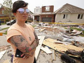 An F2-Category tornado tore through Sun King Cres. and Majesty Blvd. in south Barrie, leaving a swath of destruction to homes. Natalie Harris stands outside her ex-husband's home on Majesty Blvd. Natalie was in the home with their son and two dogs when the tornado hit.