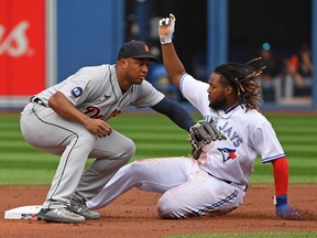 Toronto Blue Jays first baseman Vladimir Guerrero Jr. (27) steals second base against the Detroit Tigers’ Jonathan Schoop Saturday at Rogers Centre.