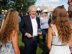 Conservative leadership contestant Jean Charest meets supporters at the conservative BBQ during the Calgary Stampede on July 9, 2022.