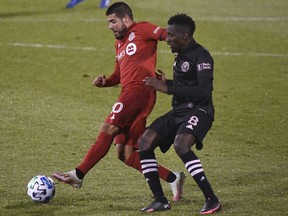 Toronto FC's Alejandro Pozuelo controls the ball as Inter Miami's Blaise Matuidi defends during the second half of an MLS match, Sunday, Nov. 1, 2020, in East Hartford, Conn.