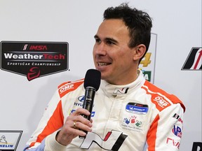 Robert Wickens answers questions during a press conference for the Rolex 24 Hour Auto Race at Daytona International Speedway, Thursday, Jan. 27, 2022, in Daytona Beach, Florida.