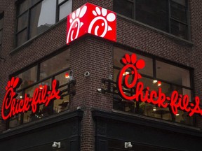 A franchise sign is seen above a Chick-fil-A restaurant after its grand opening in Midtown, New York City, Oct. 3, 2015.