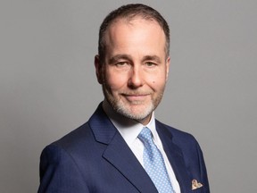 An undated handout photograph released by the U.K. Parliament shows Conservative MP for Tamworth, Christopher Pincher, posing for an official portrait photograph at the Houses of Parliament in London.