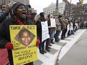 This Nov. 25, 2014, file photo, shows demonstrators blocking Public Square in Cleveland, during a protest over the police shooting of 12-year-old Tamir Rice.