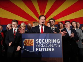 In this Nov. 6, 2018, file photo, Arizona Gov. Doug Ducey, speaks to supporters at an election night party in Scottsdale, Ariz.