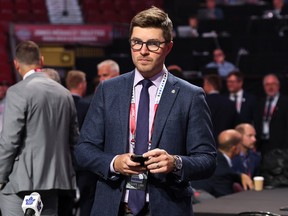 Maple Leafs GM Kyle Dubas looks on during Round 2 of the NHL draft in Montreal. After acquiring goalie Matt Murray from the Ottawa Senators on Monday, Dubas has approximately $6.3 million US at his disposal under the salary cap. Some of that money will be geared toward new contracts for winger Pierre Engvall and defenceman Rasmus Sandin.