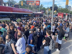 An image posted to Twitter of TTC riders waiting for shuttle buses due to a closure at Bloor-Yonge Station on Tuesday, July 26, 2022.