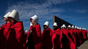 Activists in favour of the legalization of abortion disguised as characters from Canadian author Margaret Atwood's feminist dystopian novel "The Handmaid's Tale." (Photo by ALEJANDRO PAGNI/AFP via Getty Images)