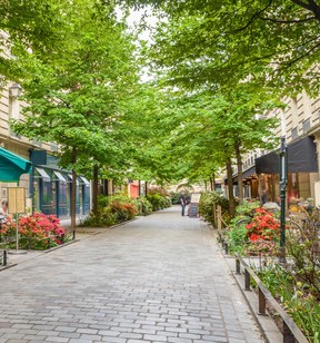 A quiet street with restaurants in the bohemian Marais district of Paris. GETTY IMAGES