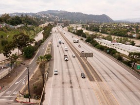 The northbound 5 freeway is mostly empty midday during the coronavirus COVID-19 pandemic in Los Angeles, California on April 13, 2020. (Photo by ROBYN BECK/AFP via Getty Images)
