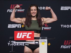 In this UFC handout,  Miesha Tate poses on the scale during the UFC Fight Night weigh-in at UFC APEX on July 16, 2021 in Las Vegas, Nevada.