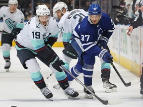 Calle Jarnkrok of the Seattle Kraken battles  Timothy Liljegren of the Maple Leafs last season in Toronto. The two will be teammates this season.