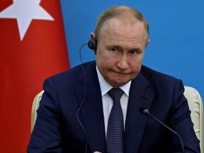 Russian President Vladimir Putin takes questions during a joint press conference with his Iranian and Turkish counterparts following their summit in Tehran on July 19, 2022.