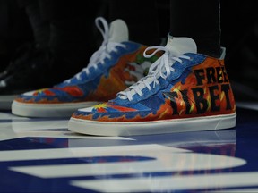 Detail of the shoes worn by Enes Kanter of the Boston Celtics with the wording "Free Tibet" during the first half against the New York Knicks at Madison Square Garden on Oct. 20, 2021 in New York City.