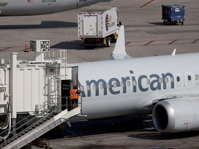 An American Airlines plane parked at its gate in the Miami International Airport on Dec. 10, 2021 in Miami, Florida.
