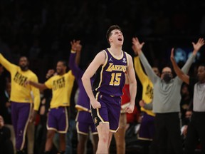 Austin Reaves of the Los Angeles Lakers reacts after a three-point basket during the fourth quarter against the Utah Jazz at Crypto.com Arena on February 16, 2022 in Los Angeles, California.