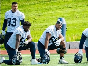 The Argos hope to have both offensive tackles Dejon Allen (left) and Isiah Cage ready to face the Blue Bombers’ vauted pass rush on Monday night at BMO Field, Running back Andrew Harris (33) will also be required to step in and help out in that department against his former team.