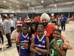 Raptors Superfan Nav Bhatia with (left to right) Tessa Newell and her kids Josiah, Tayviyah, TJ, and Tyrese.