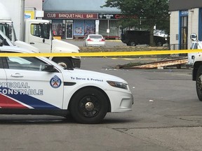 Toronto Police at the scene of a fatal stabbing in a plaza parking lot at Dufferin and Finch on July 8, 2022.