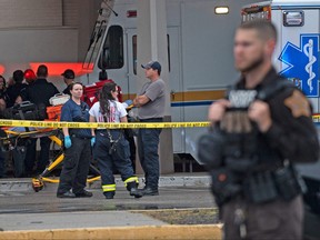 Emergency personnel gather after a shooting at Greenwood Park Mall in Greenwood, Indiana, U.S. July 17, 2022.
