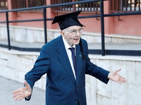 Giuseppe Paterno, Italy's oldest student, celebrates after graduating from his undergraduate degree in history and philosophy during his graduation at the University of Palermo, in Palermo, Italy, July 29, 2020.