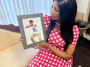 Herily Little of Ajax holds a photo of her son Stephen Little-McClacken, 24. He was gunned down and killed Saturday night near Union Station. A Vaughan man is charged with second-degree murder.