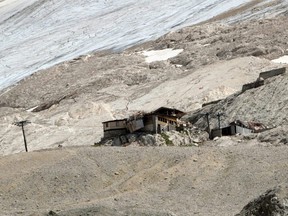 A picture taken Tuesday, July 5, 2022 near Canazei shows the destroyed arrival  station of the chairlift two days after a block of glacial ice collapsed, killing seven people.
