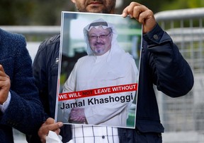A demonstrator holds picture of Saudi journalist Jamal Khashoggi during a protest in front of Saudi Arabia’s consulate in Istanbul, Turkey, Oct. 5, 2018.