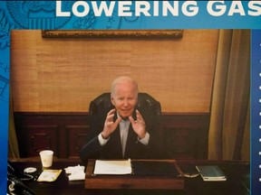 U.S. President Joe Biden, who has COVID-19, appears on a screen during a virtual meeting with his economic team at the White House in Washington, D.C., Friday, July 22, 2022.
