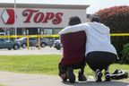 Mourners react while attending a vigil for victims of the shooting at a TOPS supermarket in Buffalo May 15, 2022. REUTERS/Brendan McDermid 