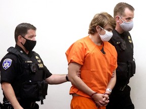 Buffalo shooting suspect Payton S. Gendron, who is accused of killing 10 people in a live-streamed supermarket shooting in a Black neighbourhood of Buffalo, is escorted in the courtroom in shackles, in Buffalo May 19, 2022.