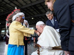 Pope Francis is welcomed after arriving at Edmonton International Airport July 24, 2022.