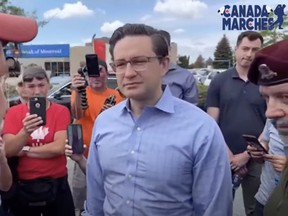Pierre Poilievre joined James Topp on his march to the National War Memorial in Ottawa, June 30, 2022.
