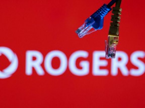 Ethernet cables are seen in front of a Rogers Communications logo in this illustration taken July 8, 2022.
