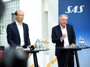 President and CEO of SAS Anko van der Werff and Chairman of the Board of SAS Carsten Dilling attend a news conference in Stockholm, Sweden July 5, 2022.