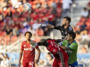 Toronto FC goalkeeper Quentin Westberg (16) makes a save against Seattle Sounders forward Fredy Montero (12) during the first half at BMO Field.