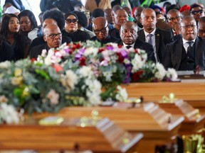 South African President Cyril Ramaphosa looks on as he joins mourners gathered to grieve the still-mysterious deaths of 21 teenagers in a poorly ventilated local tavern, in East London, South Africa, July 6, 2022.