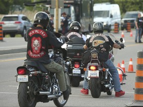 A trio of bikers, two Hells Angels from the Toronto chapter arrived with a Red Line puppet gang member mid-afternoon to party at the Brooklin chapter clubhouse as part of the Canada Run weekend on Friday July 22, 2022.