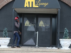 Outside the ATL Lounge at 2200 Hwy. 7 , Unit 1 where two men were shot dead Saturday morning. A woman is listed in stable condition.
